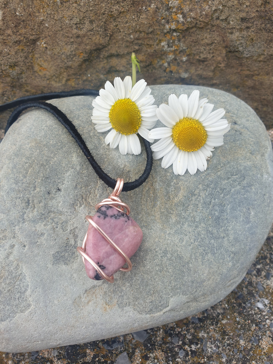 Rhodonite pendant necklace on a leather cord with a clasp
